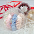 Christmas ball decoration with four narrow silk scrunchies